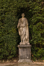 Statue Of A Person In Old Italian Garden 