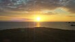 Drohnenaufnahme, Drohnenflug von der Küste zum Leuchtturm Phare du Four in mitten des atlantischen Ozean mit Brandung und Wellen, Sonnenuntergang, Gegenlicht, Département Finistère, Frankreich