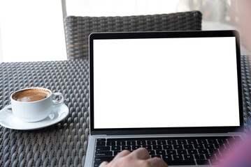 Wall Mural - Computer blank screen mockup. Man working on laptop with blurred background for advertising, online job, business search on table at coffee shop