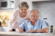 © Nicholas Felix/peopleimages.com - They were as sharp as we were in love. Shot of an elderly couple going over paperwork at home.