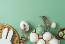 Easter Holiday Composition With White Eggs And Decoration On Green Background. Top View, Flat Lay
