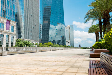 Canvas Print - Green park next to office buildings