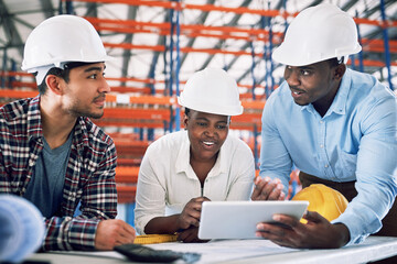 Poster - Here comes another top quality design. Shot of a group of builders having a meeting at a construction site.