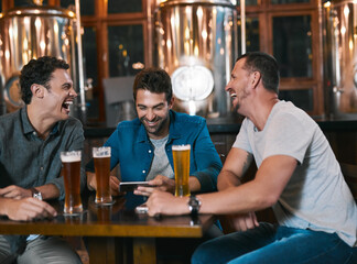 Aufkleber - Time to talk business over a beer. Shot of three cheerful young men drinking beer together at a table inside of a beer brewery during the day.