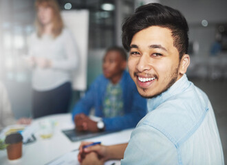 Poster - His ideas are a cut above the rest. Cropped portrait of a young businessman looking over his shoulder during a presentation in a boardroom.