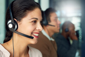 Aufkleber - There to help resolve your issues quickly and efficiently. Cropped shot of a call centre agent working in an office with her colleagues in the background.