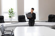 © Olga - attractive young man in the office in a conference room alone