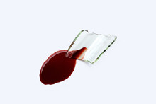 Glass Shard With Blood On White Background.