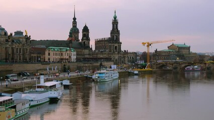 Wall Mural - Dresden, Germany. View at main landmarks in the city of Dresden, Germany at sunset. Time-lapse from day to night with car traffic and reflection in the river, zoom in