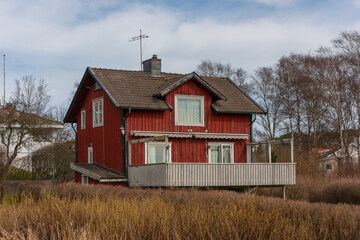 Wall Mural - Old red two storey wooden house.