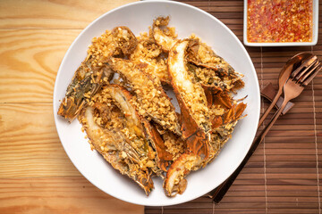 Sticker - Stir fried flathead lobster with garlic and pepper on wooden table, Fried flathead lobster with garlic.