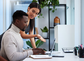 Poster - this is the best choice we have. shot of two businesspeople working together on a laptop in an offic