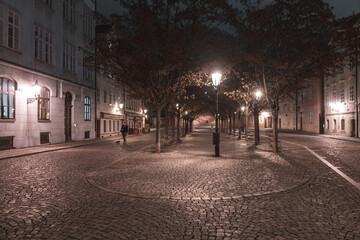 glowing lantern from street lights on a snowy square