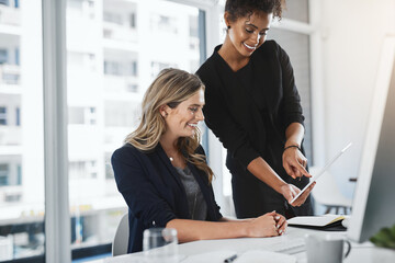 Aufkleber - Their office only runs on modern tools. Shot of two businesswomen working together in an office.