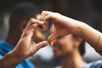 Poster - My heart will always be yours. Cropped shot of a young couple making a heart gesture with their hands outdoors.