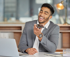 Leinwandbilder - Let nothing out-hustle your hard work. Shot of a young businessman using a smartphone and laptop in a modern office.