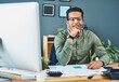 © Katleho Seisa/peopleimages.com - He calls the shots in the office. Portrait of a cheerful young businessman seated behind his desk busy working inside of the office during the day.