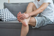 © staras - Foot pain, man suffering from feet ache at home
