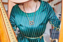 Celtic Knot Jewel Visible Through Harp Strings