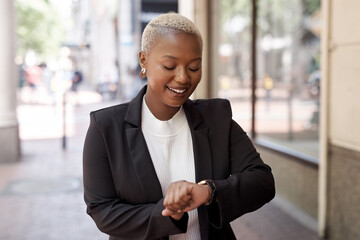 Aufkleber - Staying on track and on time. Shot of a young businesswoman checking the time on her wristwatch while out in the city.