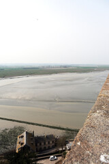 Rocket island, famous sanctuary abbey Monastery fortress Mont Saint Michel in Normandy, France. Tourist sight attraction with breathtaking nature landscape coast and historic medieval old town house	