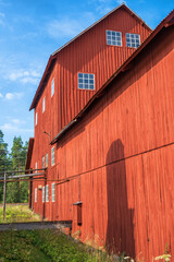 Canvas Print - Old red industrial building for peat