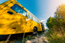 Yellow School Bus On A Country Road