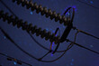 Corona discharge on high power transmission line on a night sky background