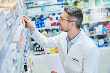 Poster - We have what the doctor prescribed. Shot of a mature pharmacist working in a pharmacy.