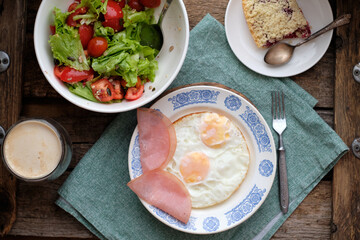 Sticker - Breakfast. Salad with tomatoes and lettuce, scrambled eggs with bacon and a piece of crumble