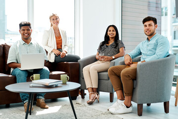 Poster - The team who know all about developing top ideas. Portrait of a group of businesspeople having a discussion in an office lounge.
