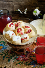 Sticker - Buns with cherry and cream sauce. cherry compote. side view.