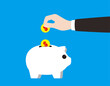 © hakule - Businessman putting dollar coin into a piggy bank