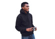 © guas - Portrait of smiling young african man photographer with film camera looking away wearing black hoodie isolated on white background