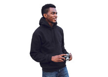 Portrait Of Smiling Young African Man Photographer With Film Camera Looking Away Wearing Black Hoodie Isolated On White Background