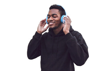 Wall Mural - Portrait of smiling young african runner man in wireless headphones enjoying listening to music wearing black hoodie isolated on white background