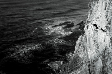 Poster - View of the cliffs in Atlantic Ocean, Portugal. Black and white photo.