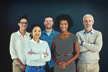 Poster - Were the team you need. Portrait of a diverse team of creative colleagues posing in the studio.