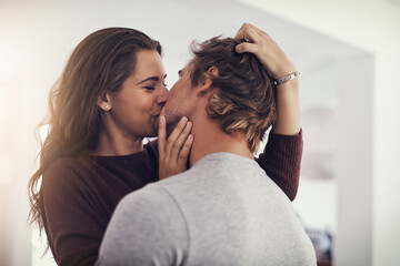 Sticker - Your kisses make me melt. Shot of a young couple making out in the kitchen.