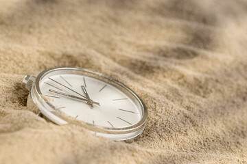 Pocket watch On Sand Beach