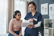 © Jeff Bergen/peopleimages.com - These are all the possible causes. Shot of a young female doctor talking to a patient in an office.