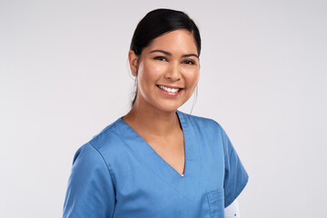 Aufkleber - Medicine cures disease, doctors cure people. Portrait of a young beautiful doctor in scrubs against a white background.