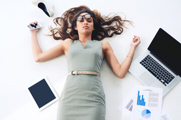 Poster - Shes done. High angle shot of a young businesswoman lying on her office floor.