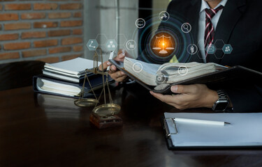 Concepts of Law and Legal services. Lawyer working with law interface icons. Blurred background.	