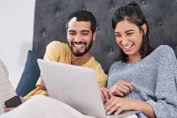 Poster - Date night without having to leave the bed. Shot of a young couple using a laptop together in bed.