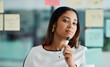 © Arnéll Koegelenberg/peopleimages.com - Brainstorming improves your critical thinking and problem-solving skills. Shot of a young businesswoman brainstorming with notes on a glass wall in an office.