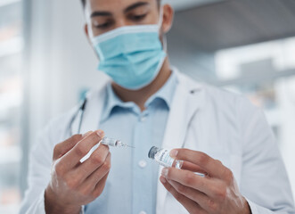 Poster - Administering vaccines on the daily. Cropped shot of a young male doctor preparing the covid 19 vaccination for a patient.