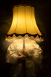 © Westend61 - Woman holding illuminated smoky lamp in front of face
