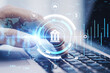 © Who is Danny - Close up of hands using laptop keyboard on desktop with creative online banking hologram on blurry background. Technology, fintech and finance concept. Double exposure.