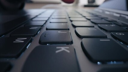 Close-up Moving Macro Shot: close up hands typing on keyboard programmer coding software gamer using keyboard